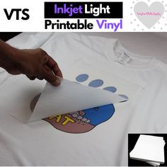 a person is making a t - shirt out of paper