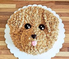 there is a cake made to look like a dog's face on the table