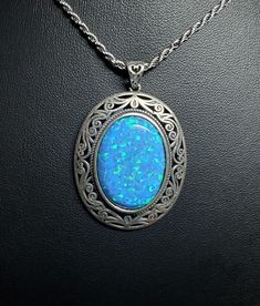 Huge Beautiful Blue Opal Necklace, 18x25mm Lab Created Blue Opal With Green And Lavender Fire, See Video! 925 Sterling Silver Vintage Style, Bezel Setting, Antique Finish Sterling With Sterling Chain. Gift Box Included. Blue Jewelry With Large Pendant For Formal Occasions, Formal Blue Jewelry With Large Pendant, Formal Blue Oval Pendant Necklace, Blue Gemstone Oval Pendant Jewelry, Formal Blue Cabochon Necklace, Blue Jewelry With Large Oval Pendant, Blue Oval Gemstone Necklace, Blue Oval Cabochon Necklace, Blue Oval Cabochon Jewelry