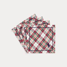 four plaid napkins on top of each other, one with a moose in the middle