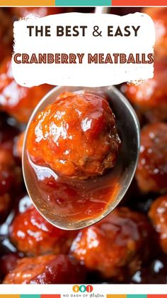 a spoon full of cranberry meatballs with text overlay that reads the best and easy cranberry meatballs