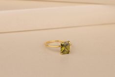 This small and delicate Peridot Birthstone Ring is the perfect addition to your collection. Each ring is made with 10K, 14K and 18K gold solid or 925 sterling silver features an intricate setting for a truly unique look. The Peridot is one of the most precious gemstones known to man, naturally green in color and beautifully bright. This lovely petite-sized ring will add just the right amount of sparkle to any outfit! Details of the product Material: 10K and 14K, 18K Solid Gold, Silver Gemstone: Peridot Gemstone Gemstone Size: 7x9 mm Unique Gift For people whom you love; Mom, Girlfriend, Wife, Fiance, Best Friend; Dainty Gift Idea; Valentine's Day Gift, Birthday Gift, Anniversary Gift, Gift For Engagement or Wedding, Promise Gift, Christmas Gift, Black Friday Gift, Mother's Day Gift, Intern Green Citrine Rings For Gifts, Peridot Ring Gold, Peridot Birthstone Ring, Peridot Birthstone, August Birthstone, Peridot Gemstone, Peridot Ring, Best Friend Gift, August Birth Stone