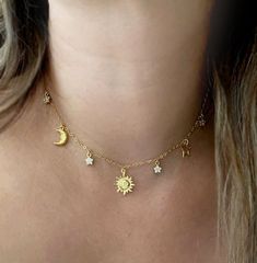 "Gold Celestial charm necklace, Gold sun and moon charm necklace, I love you necklace, gift for women, Birthday gift, Moon and star necklace Our Sun and Moon Necklace, a dainty celestial charm necklace featuring a sun charm, crescent moon, and star. The perfect symbol of love and affection, this necklace carries the message \"Love you to the moon and back.\" A beautiful and meaningful gift. --------------------------------------------------------------------- + FEATURES + * 18K Gold Vermeil Charms * Gold filled chain and clasp  --------------------------------------------------------------------- ** HOW TO TAKE CARE OF YOUR JEWELRY ** - Remove your jewelry when swimming, sunbathing ad showering - Keep them away from chemicals like perfumes, body creams & hairspray - Do not wear your jewelr Dainty Sun And Moon Charm Necklaces As A Gift, Dainty Sun And Moon Charm Necklace For Gift, Dainty Sun And Moon Charm Necklace Gift, Dainty Sun And Moon Design Charm Necklace As Gift, Adjustable Sun And Moon Design Necklace, Dainty Sun And Moon Jewelry For Anniversary, Dainty Sun And Moon Design Jewelry For Anniversary, Minimalist Jewlery, Moon And Stars Necklace