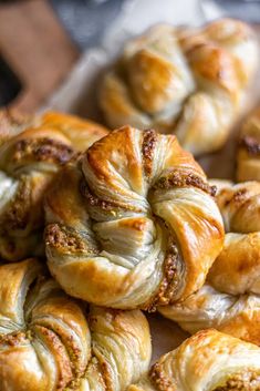 several croissants are piled on top of each other and ready to be eaten