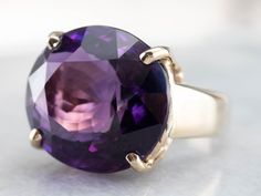 This amethyst cocktail ring makes a big statement! The amethyst is a deep purple hue with glittering tones of fuchsia and lilac. Set into an east to west style mounting, the gemstone is complimented beautifully by the warmth of the yellow gold. This ring is stylish and glamorous! Metal: 14K Yellow Gold Gem: Amethyst 20.12 Carats Gem Measurements: 17.5 x 19.4 mm, Oval Ring Size: 8.50 Marks: "14K" Stamped on the inside band Yellow Gold Sapphire Ring, Amethyst Cocktail Ring, Princess Jewelry, Amethyst Gold, Gold Cocktail, Gold Cocktail Ring, Cameo Ring, Amethyst Gem, Right Hand Rings