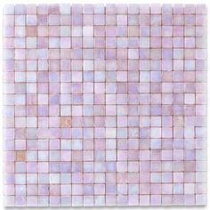 a pink and white tile wall with square tiles on the bottom, in different shades