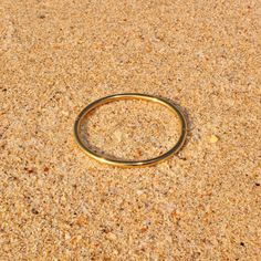 Inspired by the beauty of Kos, a Greek island known for its serene beaches, the Kos Bangle brings a simple, effortless vibe to your daily look. Its smooth, tubular design makes it a versatile addition to any wardrobe—perfect for wearing alone or, my favorite, stacking. 18k Premium Gold Plated Stainless Steel Sold as 1 bangle or a set of 2 bangles Inner Diameter: 2.4” Width: 0.13" Weight: 0.7 oz Delivered in our custom Sanaa. keepsake pouch Dispatched from South Florida Minimalist Beach Bracelets, Minimalist Beach Bracelet Jewelry, Silver Shop, Greek Island, Bangle Set, Chain Ring, Daily Look, South Florida, Shop Necklaces