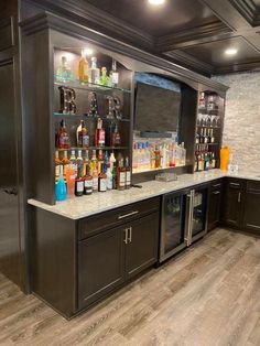 a bar with liquor bottles on the shelves