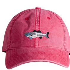 a pink hat with a fish embroidered on it