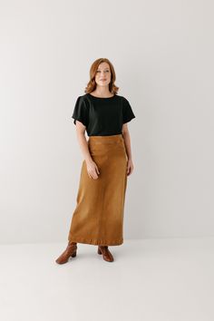 A well-loved denim skirt now in camel! Simple lines, classic, and comfortable, the 'Sara' is everything a denim skirt should be! This timeless long denim skirt is made from a stretch denim material that falls straight from the hips to ensure a modest and flattering fit. Featuring a wide waistband for extra comfort and ease of styling. Wear the 'Sara' comfortably from day to night with your favorite cozy sweater or a simple tee! 97% Cotton 3% Spandex Machine Wash Cold Do Not Bleach Hang to Dry Lo Everyday Fall Lined Skirt, Lined Denim Skirt For Workwear In Fall, Fall Workwear Denim Skirt With Lining, Fall Workwear Lined Denim Skirt, Everyday Midi Skirt For Fall, Everyday Fall Midi Skirt, Casual Brown Midi Pencil Skirt, Solid Non-stretch Casual Denim Skirt, High-rise Stretch Cotton Denim Skirt