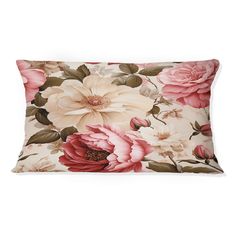 a floral pillow with pink and white flowers on the front, sitting against a white background