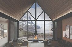 a living room filled with furniture and a fire place in the middle of a room