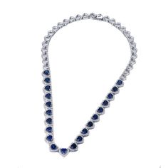 This elegant necklace features a beautiful lab-created sapphire. The necklace is designed to enhance any outfit and is sure to be a timeless addition to your jewelry collection. Features The necklace in sterling silver has a classic and luxurious design that is perfect for any occasion. Made all by hand! It truly deserves a spot in every jewelry collection. Beautifully crafted, this style is sure to become a treasured keepsake. It is made of 925 sterling silver. Made to last a lifetime, strong a Formal Heart Cut Cubic Zirconia Necklace, Formal Heart Pendant Jewelry In Cubic Zirconia, Elegant Round Gemstone Tennis Necklace, Elegant Gemstone Tennis Necklace, Formal White Gold Tennis Necklace With Gemstone, Elegant Heart Cut Cubic Zirconia Necklace, Elegant White Gold Heart Necklace With Gemstone, Formal Gemstone Tennis Necklace, Luxury Heart Pendant Necklace For Formal Occasions