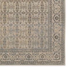 a beige and blue rug with an intricate design