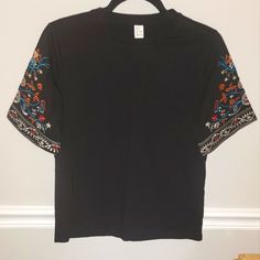 Nwot Women's Black Top W/ Embroidered Boho Bell Half Sleeve, Size Small I Ordered 2 By Mistake Super Cute, Always Get Compliments On This Top! Loose Fit, Perfect For A Night Out Or The Office! Fitted Black Top With Embroidered Sleeves, Black Cotton Tops With Embroidered Sleeves, Casual Black Top With Embroidered Hem, Casual Black Embroidered Top With Short Sleeves, Casual Embroidered Short Sleeve Top, Black Embroidered Short Sleeve Top, Black Short Sleeve Embroidered Casual Top, Casual Fitted Black Embroidered Top, Black Fitted Cotton Embroidered Top