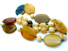 Statement Gemstone Jewelry - This is a substantial green & yellow agate and yellow quartz bead necklace. It is hallmarked 925, has sterling silver clasp and extension, chain, widest bead is 1.25" wide. It is 30" long, which includes the 2" extension, so it can be worn from 28" to 30" in length. Weight is 189 grams. Yellow Agate, Yellow Quartz, Bead Necklace, Green Yellow, Gemstone Jewelry, Agate, Beaded Necklace, Gemstones, Beads