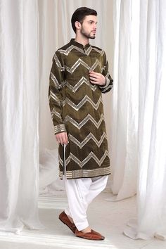 Olive kurta with threadwork chevron patterns, embellished by mirrorwork. Comes with patiala. - Aza Fashions Multicolor Embroidered Kurta With Mirror Work For Festive Occasions, Multicolor Embroidered Straight Kurta With Gota Work, Designer Multicolor Embroidery Kurta With Gota Work, Ceremonial Straight Kurta With Mirror Work, Ceremonial Kurta With Mirror Work For Diwali, Festive Embroidered Kurta With Gota Work, Ceremonial Unstitched Kurta With Mirror Work, Unstitched Ceremonial Kurta With Mirror Work, Patiala For Men