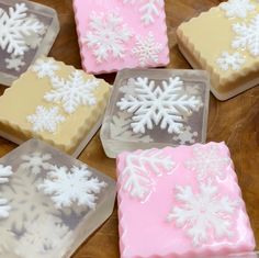 snowflake shaped soaps sitting on top of a wooden table