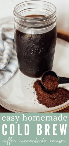 homemade cold brew coffee concentrate recipe in a mason jar on a plate with spoons