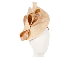 Large nude twisted plate decorated with silk abaca bow. Hand made in Melbourne by our skillful milliners, this headpiece will be a crown jewel of your spring racing outfit.   Made in Australia  Exclusive materials  Stylish design by Fillies Collection  Comfortable headband Elegant Cream Headband For Spring, Elegant Beige Headpieces For Spring, Elegant Summer Event Hair Accessories, Elegant Adjustable Headpieces With Ribbon, Elegant Beige Hair Accessories For Spring, Beige Headpiece For Kentucky Derby Event, Beige Evening Headpiece For Spring, Elegant Fitted Cream Hair Accessories, Elegant Structured Crown Headband For Summer