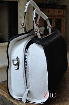 Lena Black & White Coach - shopzambony Chic Satchel With Zipper Closure For On-the-go, Elegant Travel Satchel With Cell Phone Pocket, Chic Satchel With Zipper Closure For Daily Use, Elegant Satchel With Cell Phone Pocket, Elegant On-the-go Satchel With Cell Phone Pocket, Chic Rectangular Satchel With Cell Phone Pocket, Chic Crossbody Satchel With Zipper Closure, Chic Satchel With Cell Phone Pocket, Chic Satchel Tote With Cell Phone Pocket