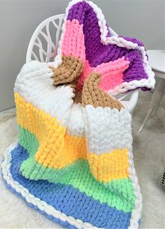 This bright and beautiful blanket is perfect for Easter! Size 40x60 inches, medium Puffy Ip, Easter Blanket, Chunky Yarn Blanket, Crochet Queen, Chunky Blankets, Finger Knit, Yarn Blanket, Knitting Blanket, Hand Knitting Diy