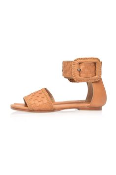 These leather sandals are made to order from high quality soft leather. Delight in the craftsmanship of these jaw dropping Madagascar leather sandals. Featuring woven leather upper with braided accents and large decorative leather bound buckle these sandals will keep you sleek and chic anywhere you go. Style them with your mini wrap dress to elevate your everyday casual look or with your floaty maxi skirt for a super chic style. -Smooth leather lining and insole with embossed logo -Lightly padde Adjustable Leather Sandals With Woven Sole, Brown Leather Woven Sandals, Natural Woven Leather Flat Sandals, Brown Leather Braided Sandals, Brown Bohemian Woven Sandals, Leather Woven Huarache Sandals With Ankle Strap, Leather Woven Ankle Strap Huarache Sandals, Bohemian Leather Sandals With Buckle Closure, Bohemian Woven Leather Beach Sandals