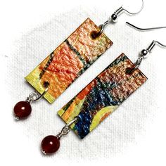 Make a Fashion Statement!  Wearable Art on your ears--Mixed Media Abstract on 300 pound Watercolour paper sealed with Gloss Medium and embellished with glass or semiprecious beads. Free shipping and if you live in Victoria, BC, you can find a selection of these unique earrings at the Gage Gallery Artists Collective, 19 Bastion Square, Victoria, BC. Please inquire before you order, as your selection may have sold already. I can also customize for you. Thank you! Artistic Colorful Beaded Earrings For Gifts, Artistic Colorful Beaded Earrings As Gift, Artistic Earrings With Colorful Beads For Gift, Artistic Earrings With Colorful Beads As Gift, Artistic Dangle Earrings With Colorful Beads, Rectangular Jewelry With Dangling Beads For Gifts, Gift Jewelry With Dangling Rectangular Beads, Artsy Colorful Beaded Earrings As Gift, Artsy Earrings With Colorful Beads As Gift