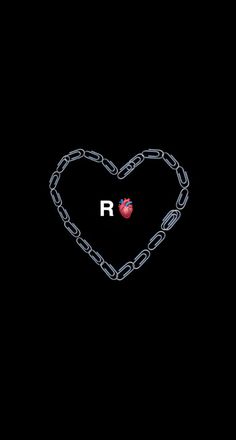 the letter r is in the shape of a heart with a chain attached to it