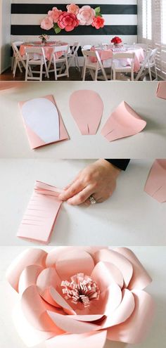 pink paper flowers are arranged on the table