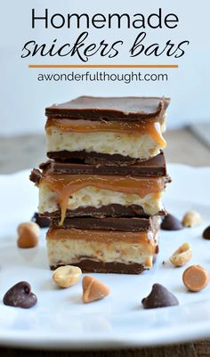 homemade snickkers bars stacked on top of each other with peanut butter and chocolate