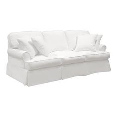 a white couch with pillows on it