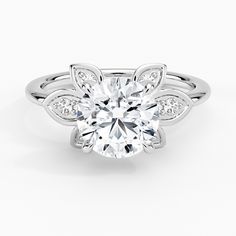 a white gold engagement ring with an oval cut diamond