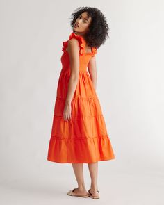 This floaty, flirty, light dress is about to become your fave for summer. Flattering A-line cut, smocked elasticated top, tiered poplin skirt. The sleeveless style has ruffle detailing and all in breathable, natural 100% organic cotton poplin. It's soft, comfy, and the midi-length has the potential to be dressed up or down.  | Quince | Women's Smocked Midi Dress in Vermilion Red, Size Large, Organic Cotton Cotton Smocked Dress With Tiered Skirt For Summer, Summer Smocked Tiered Dress For Brunch, Summer Tiered Smock Dress For Brunch, Summer Smocked Tiered Dress, Summer Tiered Smocked Dress With Ruffles, Summer Brunch Tiered Smock Dress, Summer Smock Tiered Dress, Orange Summer Midi Dress With Ruffles, Casual Red Midi Dress With Smocked Bodice