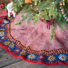 a small christmas tree with ornaments on it