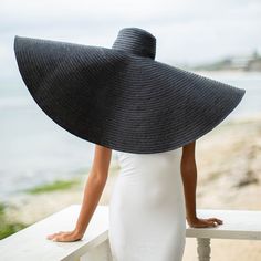 SOLANA Oversized Wide-brim Straw Hat is a statement piece that will keep the spotlight on you while enjoying the sun. Crafted from braided natural straw, the SOLANA hat has an oversized brim guaranteed to provide full coverage from the sun’s harsh rays. Fold the brim as needed to style.DETAILSComposition: 100% Natural StrawsThe brim measures approx 15” in lengthFull hat diameter measures approx 38.5”Slip-on, secure with chin strap Color: Black Designed in California, handmade by artisans in Bali Wide Brim Straw Hat, Enjoying The Sun, British Indian, Independent Designers Fashion, Black Media, Black Design, Wide Brimmed, Straw Hat, Caribbean Netherlands