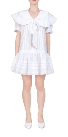 Upgrade your wardrobe with sandy liang's toki dress in white. made of crisp cotton this short sleeved mini dress features a double sailor collar with feminine ruffles and a tie. mother of pearl buttons add a touch of elegance. drop waisted for a flattering fit. perfect for any occasion.    details:    - color: white  - 100% cotton  - double sailor collar with ruffles and tie  - mother of pearl buttons  - derop waist silhouette  - vendor code: h24d003-f005  - fits true to size  - model is 5ft 5in and is wearing a size s Tie Collar Dress, Sandy Liang Dress, Sailor Collar Blouse, Sleeved Mini Dress, Spring Knits, Sandy Liang, Sailor Dress, Sailor Collar, Short Sleeve Mini Dress