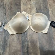 Nwt Never Worn Strapless Enhanced Lift Beige / Tan / Nude Color Comes With Straps Seperate Beige Seamless Push-up Shapewear, Beige Stretch Underwire Bra, Beige Stretch Shapewear Bra, Beige Stretch Push-up Bra, Beige Push-up Bra, Fitted Padded Beige Bra, Fitted Beige Shapewear Bra, Beige Fitted Shapewear Bra, Beige Push-up Bra With Removable Pads