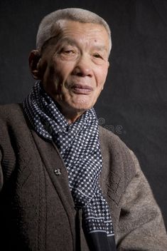 an old man wearing a sweater and tie looking at the camera royalty images, stock photos