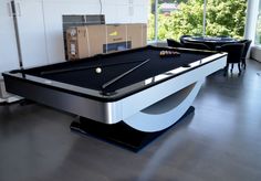 a pool table in the middle of a room