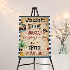 an easel with a sign that says welcome captain jonathan's birthday party enter if you dare