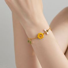 The bee symbolizes community, brightness, and personal power. Follow the bee to discover your new destination. Bee Gifts for bee lovers. Bee bracelets, high polished make bee & sunflower bracelet is very shining, very dainty, and pretty and simple but elegant. Detail Plating: 18K Gold Materials: 18K Gold on Brass, Enamel Size: Length: 6.30"(16cm)+Extender: 2.36"(6cm) Weight: 4.3g Hypoallergenic design Yellow Bracelet Jewelry For Gift, Handmade Yellow Charm Bracelet As Gift, Handmade Yellow Charm Bracelet Gift, Handmade Yellow Charm Bracelet For Gift, Dainty Yellow Bracelet For Gift, Dainty Yellow Bracelet As Gift, Yellow Bracelets With Flower Charm For Gift, Dainty Yellow Bracelet, Bee Sunflower