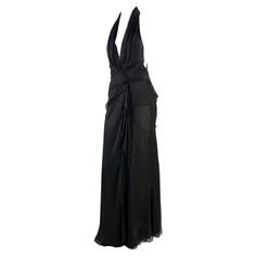 For Sale on 1stDibs - TheRealList presents: a stunning black chiffon halter neck Gianni Versace Couture gown, designed by Donatella Versace. This beautiful creation from the Formal Black Silk Chiffon Maxi Dress, Black Silk Chiffon Maxi Evening Dress, Black Floor-length Halter Dress For Gala, Black Floor-length Halter Evening Dress, Black Silk Chiffon Evening Dress For Gala, Black Silk Chiffon Evening Dress For Formal Occasions, Silk Floor-length Halter Dress For Evening, Black Silk Chiffon Evening Dress For Party, Black Silk Chiffon Party Maxi Dress