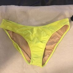 Neon Green Bikini Bottom, Brand New Condition, Never Worn. Yellow Stretch Swimwear For Beach Party, Yellow Stretch Swimwear For Beachwear, Yellow Stretch Swimwear For Sunbathing, Neon Yellow Stretch Swimwear For Summer, Stretch Neon Yellow Swimwear For The Beach, Neon Yellow Stretch Swimwear For Beach, Neon Yellow Stretch Swimwear For Beach Season, Yellow Bottoms For Beach Season Sunbathing, Yellow Casual Bottoms For Sunbathing