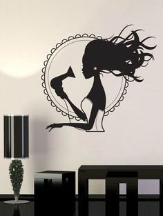 a black and white wall decal with a silhouette of a woman