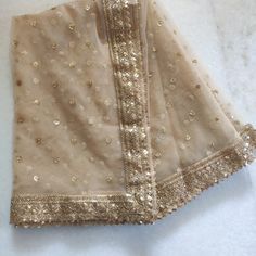 Golden Indian Dupatta party wear | Long net embroidered scarf | Punjabi dress dupattas with zari embroidery for lehenga | Dupatta This Dupatta is sequin embroidered on net with beautiful golden border. This can be your wedding dress chunni for Indian occasion wear for festival. This has perfect bling for you to look classy and ethnic at same time. This can even be your home decoration fabric for you can even wear them with lehenga. This can be made in any color. We can even make a jacket or ponc Cheap Chanderi Dupatta For Festivals, Luxury Net Dupatta With Traditional Drape, Cheap Dupatta With Mirror Work For Diwali, Luxury Chinon Dupatta With Handwork, Luxury Dupatta With Dabka Work On Net, Luxury Gold Dupatta With Chikankari Embroidery, Luxury Ceremonial Dupatta With Dori Work, Luxury Resham Embroidered Dupatta For Celebration, Luxury Nida Dupatta With Zari Work