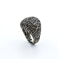 "Unique design ring, this organic pattern ring offers a true creation of natural expression. ''Organic'' wire   pathways that split and diverse in a perpetual motion. DETAILS Recycled silver (925) Oxidized finish Weight:11.7 grams Max width (top):24.8 mm Max length:22.6 mm P.S All jewellery in my collection is handmade from natural and recycled metals. Thanks to this process, all creations are unique. All handmade jewellery may have some natural imperfections, but this exact characteristic give to my jewellery their own \"soul\", their authentic style and uniqueness. My collection may not cater to all tastes, but each piece I design carries my personal aesthetics and signature." Elegant Sterling Silver Ring With Artistic Design, Metal Jewelry Making, Perpetual Motion, Organic Pattern, Pattern Ring, Organic Rings, Recycled Silver, Color Ring, Men's Rings