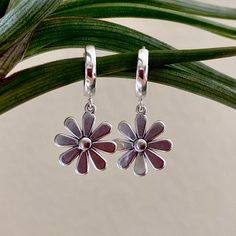 Dainty yet bold, these daisy hoops make quite the statement with their mirror shine as they dangle from your ears. They're the perfect gift if you don't know someone's ring size, and want to give them something they won't forget. Hypoallergenic & 100% sterling silver Dangles 1/2 inch from your ear lobe Each piece comes gift wrapped in recyclable Opal Dreams box and cotton bag. Our mailers are 100% compostable so please take care of the earth by disposing of the packaging responsibly.❤️ Take Care Of The Earth, Earrings Huggies, Daisy Earrings, Ear Rings, Jewelry Earrings Hoops, Cotton Bag, Etsy Earrings, Silver Jewelry, Opal