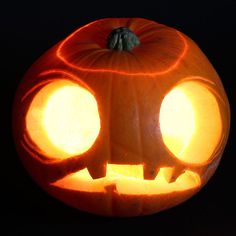 a carved pumpkin with two eyes on it