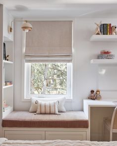 a bedroom with a window seat, desk and bookshelf